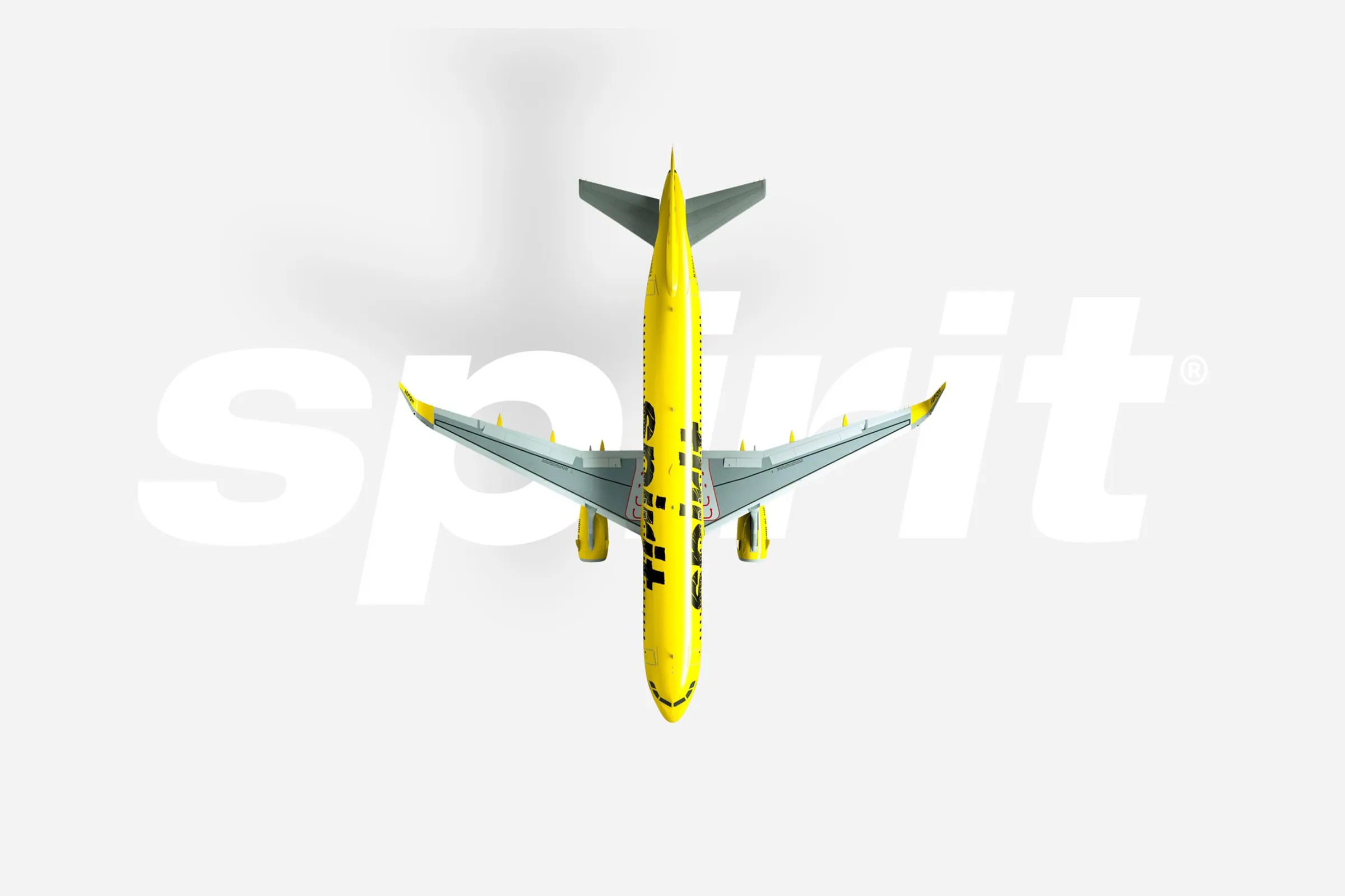A yellow Spirit Airlines jet seen from above, crossing the Spirit wordmark.