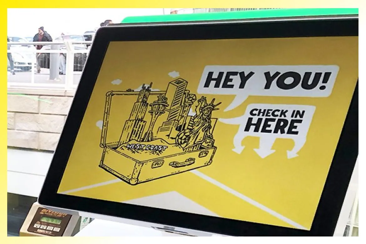 A Spirit check-in kiosk with illustrated Hey You artwork.