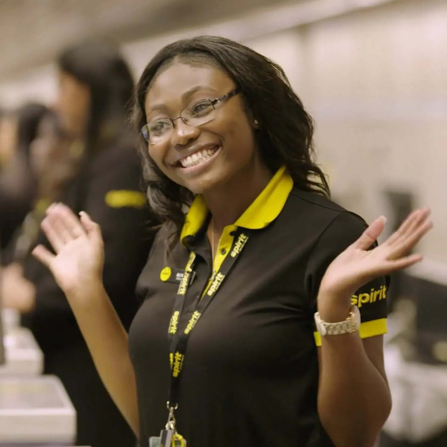 A smiling Spirit Airlines team member in uniform.